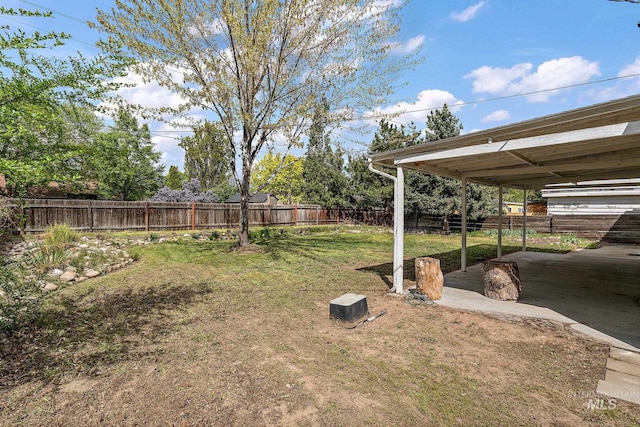 view of yard with a fenced backyard and a patio