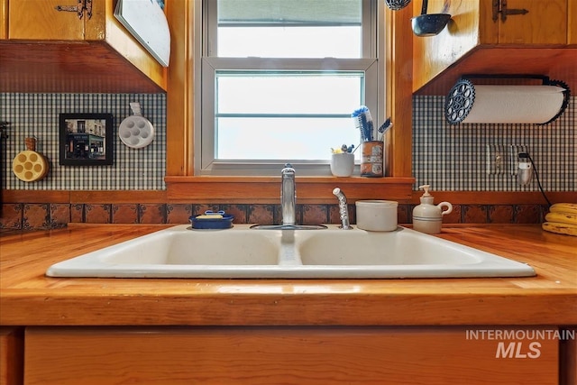 interior details with butcher block counters and sink