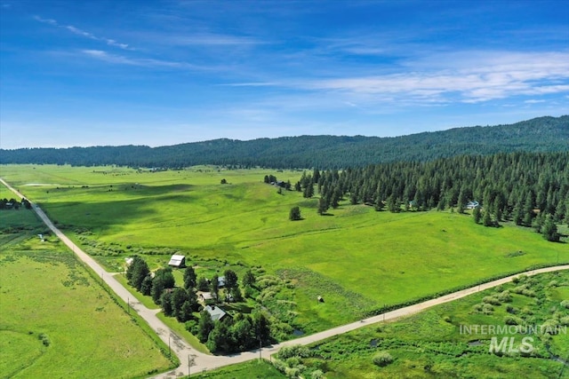 birds eye view of property with a rural view