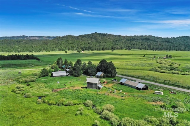 birds eye view of property featuring a rural view