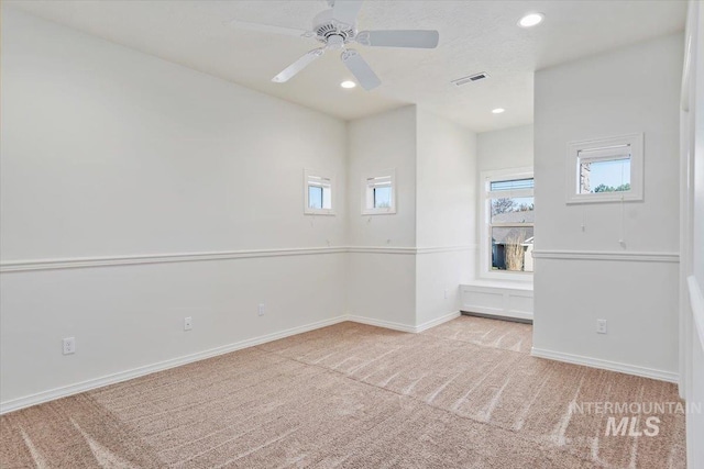 empty room with visible vents, carpet flooring, baseboards, and recessed lighting