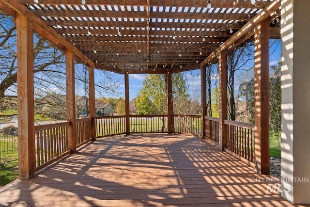 wooden terrace with a pergola