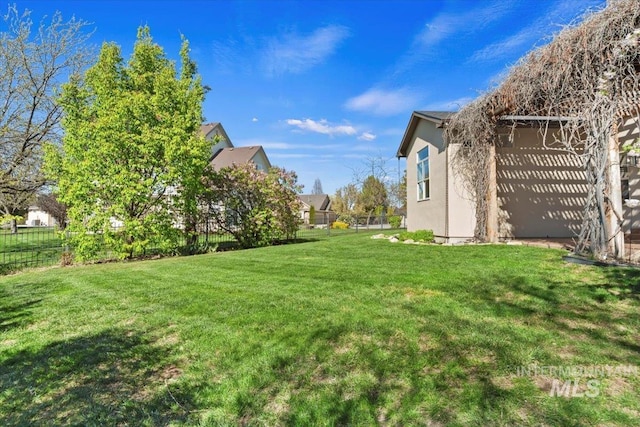 view of yard featuring fence