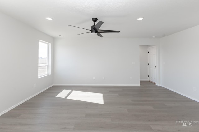 206 Marble Ave, Caldwell, ID 83605 - empty room featuring ceiling fan, recessed lighting, wood finished floors, and baseboards