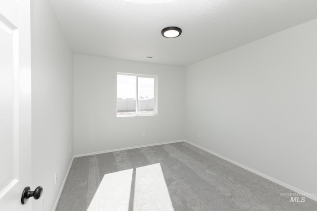 206 Marble Ave, Caldwell, ID 83605 - carpeted spare room with baseboards