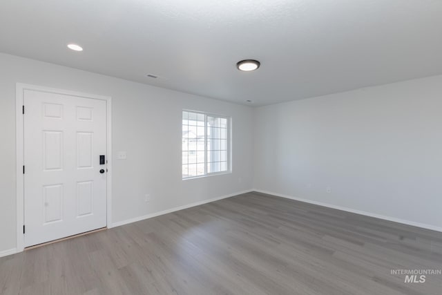 206 Marble Ave, Caldwell, ID 83605 - unfurnished room with wood finished floors, baseboards, and recessed lighting