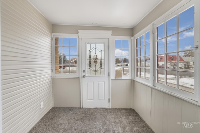 unfurnished sunroom featuring a healthy amount of sunlight