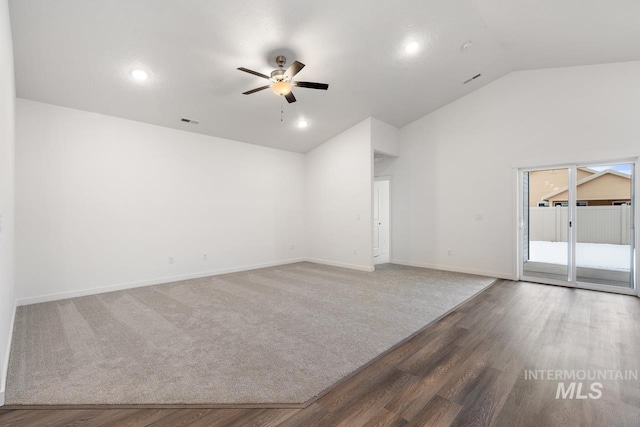 spare room featuring hardwood / wood-style flooring, ceiling fan, and vaulted ceiling