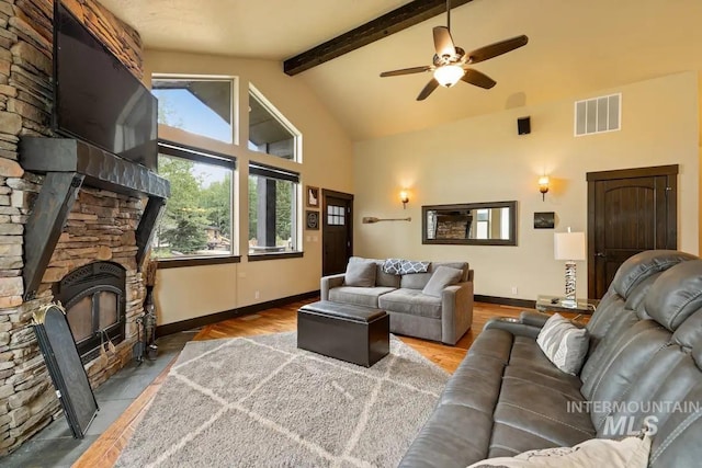 living room with beam ceiling, high vaulted ceiling, ceiling fan, and wood-type flooring