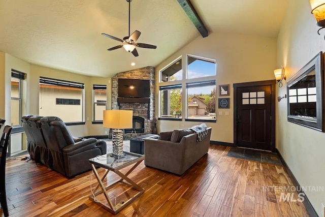 living room with vaulted ceiling with beams, hardwood / wood-style flooring, and ceiling fan