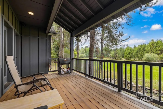 wooden terrace with area for grilling