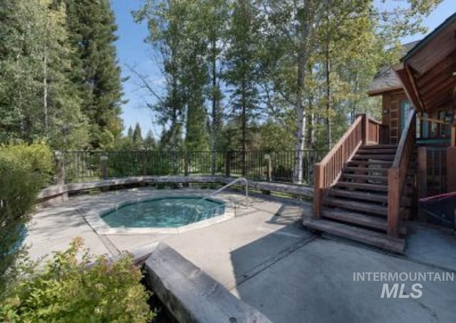 view of swimming pool featuring a patio area