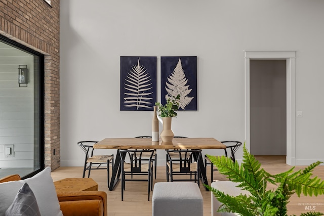 dining space featuring light wood-style flooring