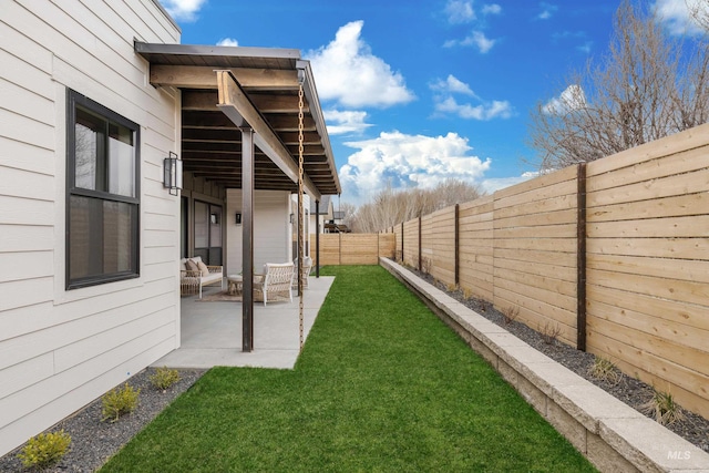 view of yard featuring a patio and a fenced backyard