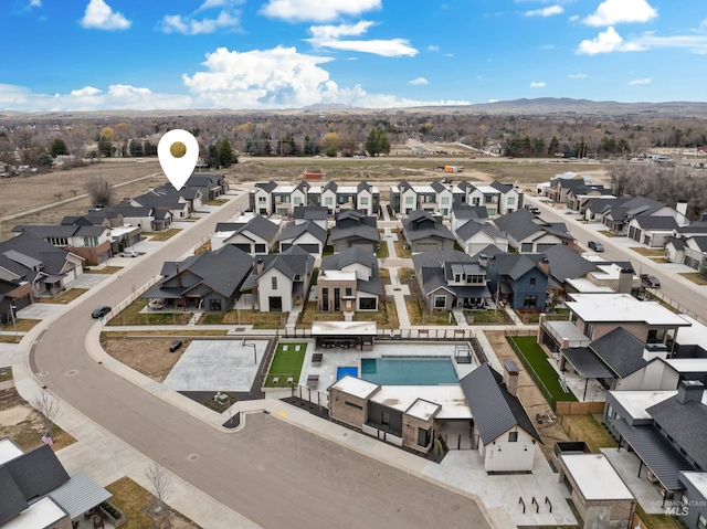 drone / aerial view featuring a mountain view and a residential view