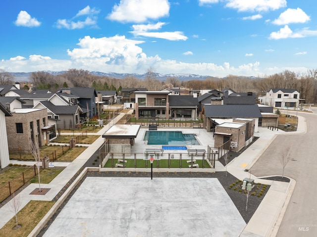 view of pool featuring a residential view, a fenced in pool, a patio, and fence