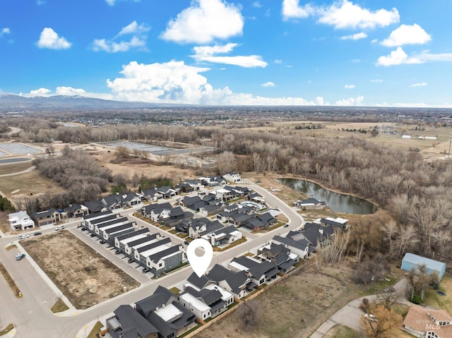 aerial view with a water view and a residential view