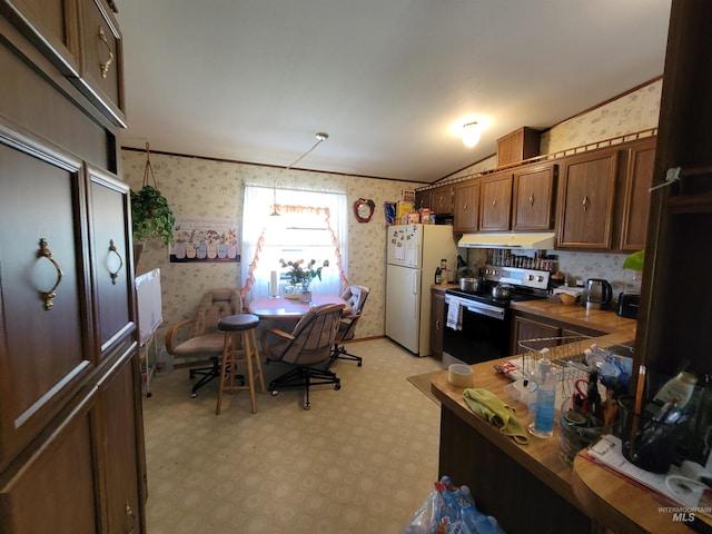 kitchen featuring white refrigerator, crown molding, stainless steel electric stove, and lofted ceiling