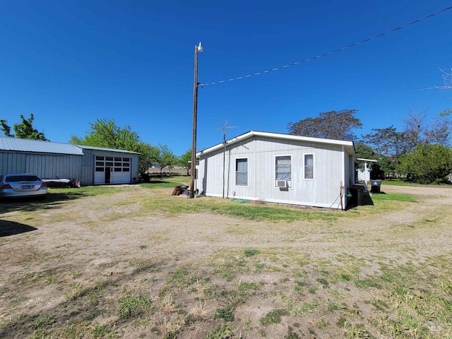 view of side of property with cooling unit