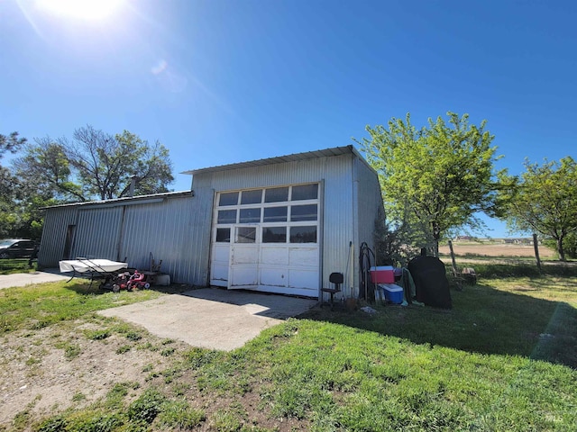 garage with a lawn