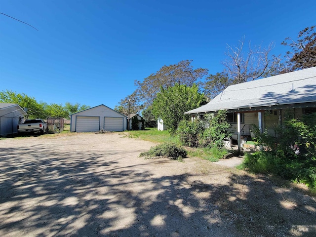 exterior space featuring an outbuilding and a garage