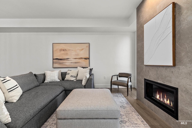1620 W Bannock St # 303, Boise, ID 83702 - living area with a large fireplace, wood finished floors, and baseboards
