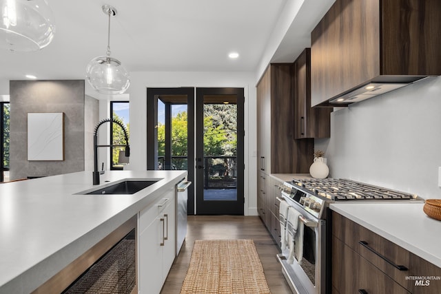 1620 W Bannock St # 303, Boise, ID 83702 - kitchen featuring gas stove, a sink, healthy amount of natural light, light countertops, and recessed lighting
