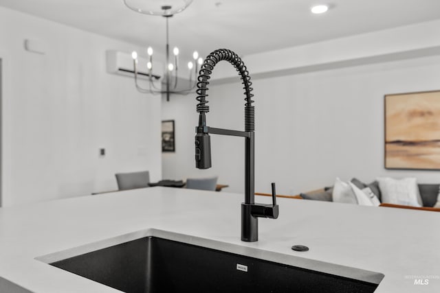 1620 W Bannock St # 303, Boise, ID 83702 - kitchen view of a sink, a wall unit AC, light countertops, hanging light fixtures, and recessed lighting