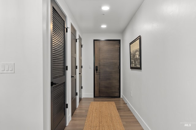 1620 W Bannock St # 303, Boise, ID 83702 - doorway to outside with baseboards, wood finished floors, and recessed lighting