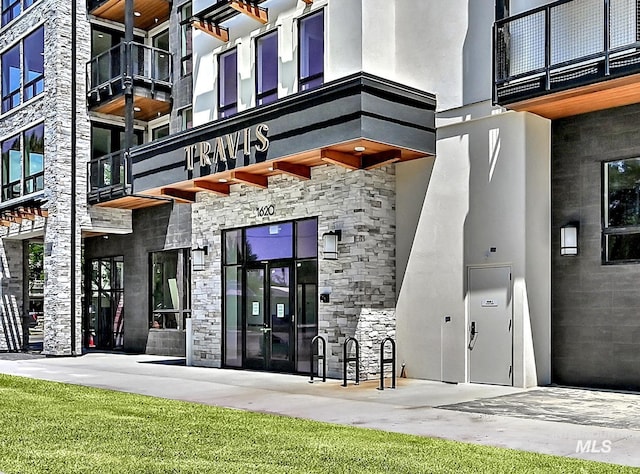 1620 W Bannock St # 303, Boise, ID 83702 - view of exterior entry featuring stone siding and stucco siding