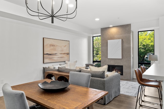 1620 W Bannock St # 303, Boise, ID 83702 - dining area with a chandelier, healthy amount of natural light, wood finished floors, recessed lighting, and a fireplace