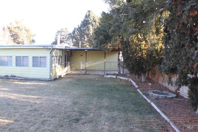 rear view of property with a lawn