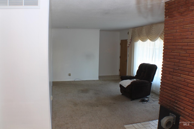 living area featuring light colored carpet