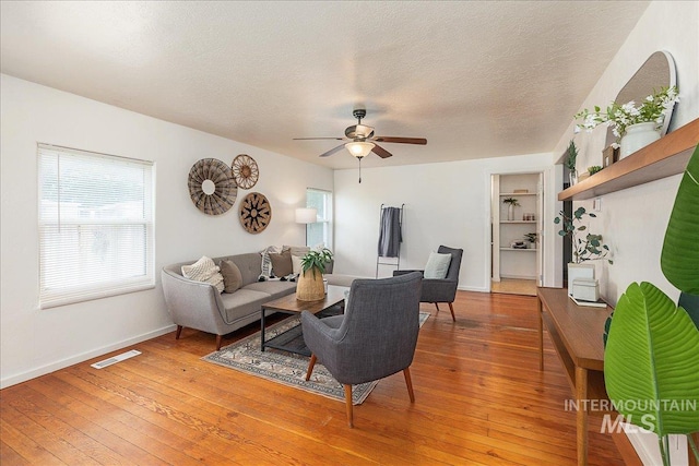 723 4th Ave N, Nampa, ID 83687 - living area with ceiling fan, light wood-style flooring, and a textured ceiling