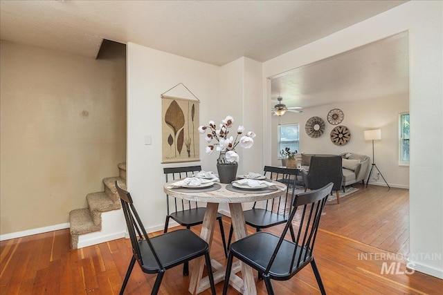 723 4th Ave N, Nampa, ID 83687 - dining room with hardwood / wood-style flooring, stairway, and ceiling fan