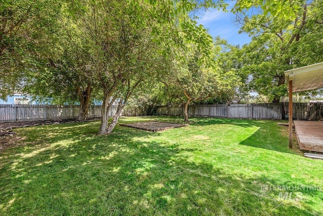 723 4th Ave N, Nampa, ID 83687 - fenced backyard with a wooden deck