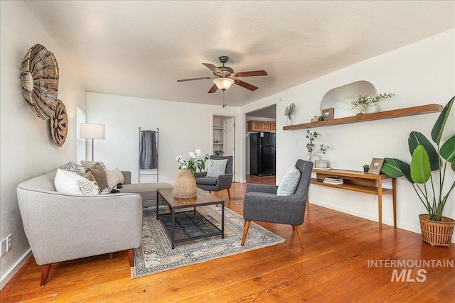 723 4th Ave N, Nampa, ID 83687 - living room featuring ceiling fan and hardwood / wood-style floors