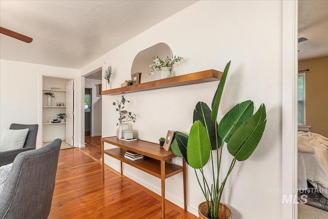 723 4th Ave N, Nampa, ID 83687 - hallway featuring wood finished floors, a textured ceiling, and built in features