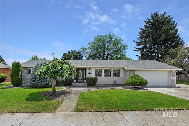 ranch-style house featuring a garage and a front lawn