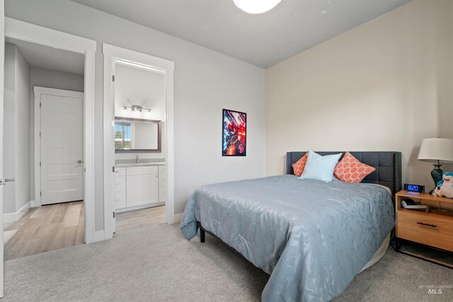 540 E Andes Dr, Kuna, ID 83634 - carpeted bedroom with connected bathroom and baseboards