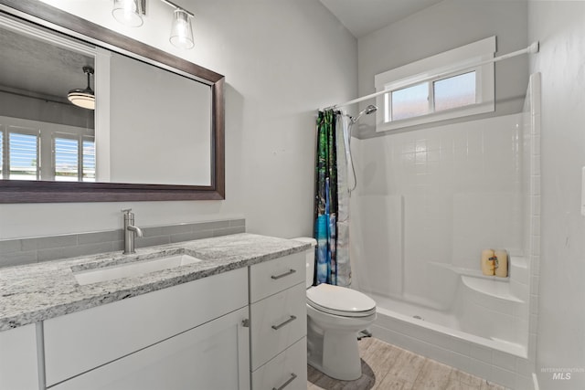 540 E Andes Dr, Kuna, ID 83634 - full bathroom featuring vanity, a shower with shower curtain, and wood finished floors