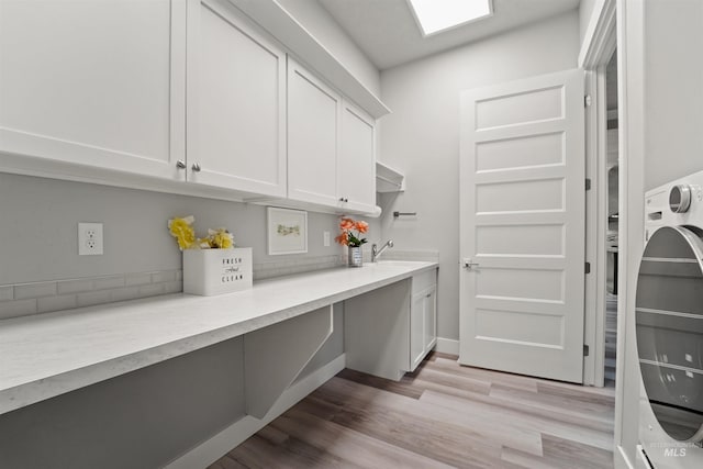 540 E Andes Dr, Kuna, ID 83634 - laundry room with cabinet space and light wood finished floors