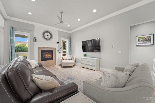 540 E Andes Dr, Kuna, ID 83634 - living room with recessed lighting, a tiled fireplace, ceiling fan, and ornamental molding