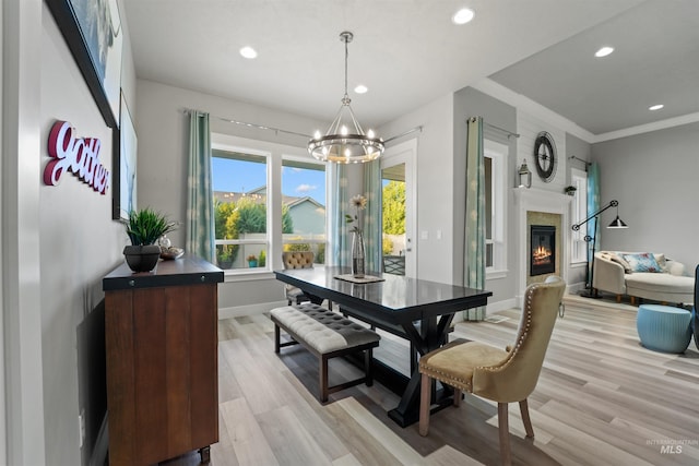 540 E Andes Dr, Kuna, ID 83634 - dining room with a chandelier, recessed lighting, light wood-style flooring, and a glass covered fireplace