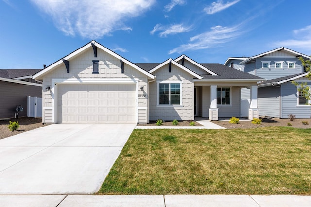 8333 S Updale Ave, Meridian, ID 83642 - view of front facade with driveway, a front yard, and a garage