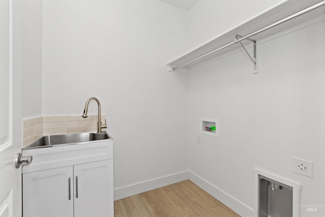 8333 S Updale Ave, Meridian, ID 83642 - laundry room featuring hookup for an electric dryer, a sink, light wood-style floors, hookup for a washing machine, and cabinet space