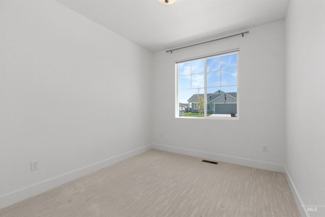 8333 S Updale Ave, Meridian, ID 83642 - spare room with baseboards, visible vents, and light colored carpet