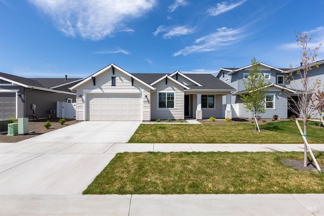 8333 S Updale Ave, Meridian, ID 83642 - view of front of home with central air condition unit, driveway, an attached garage, fence, and a front yard