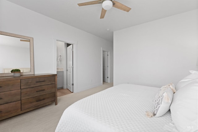 8333 S Updale Ave, Meridian, ID 83642 - bedroom featuring connected bathroom, light carpet, a ceiling fan, and baseboards