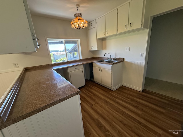 5656 Three Mile Rd, Weippe, ID 83553 - kitchen with dark wood-style flooring, a chandelier, a sink, white cabinets, and dark countertops